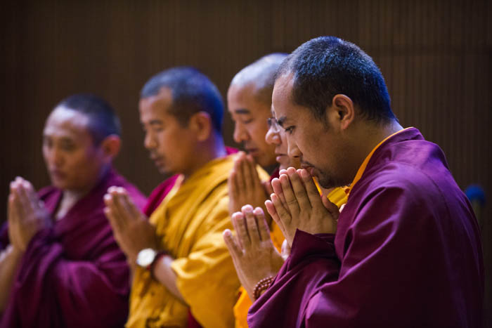 Tibetan monks lead a prayer