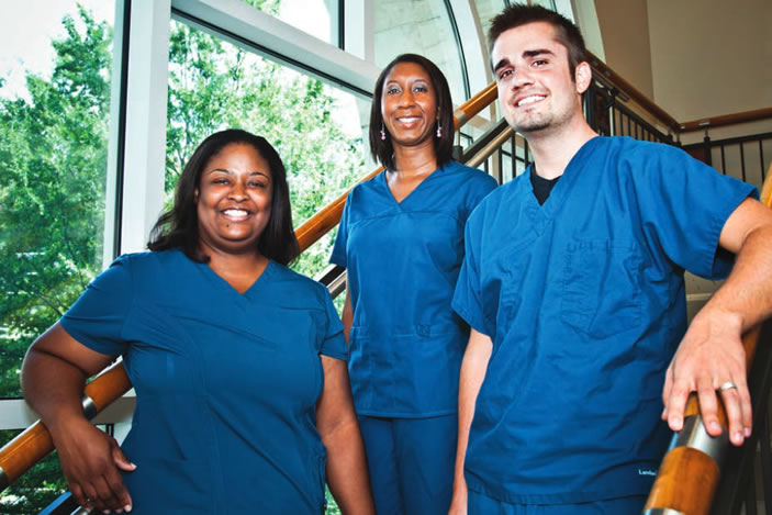 Emory-trained Serious Communicable Disease Unit nurses (from left) Crystal Johnson, Laura Mitchell, and Jason Slabach.