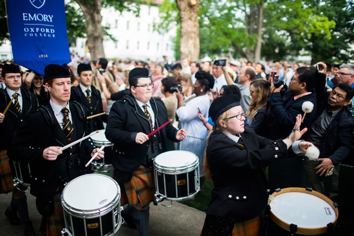 Drums lead the procession into the university-wide Commencement ceremony.