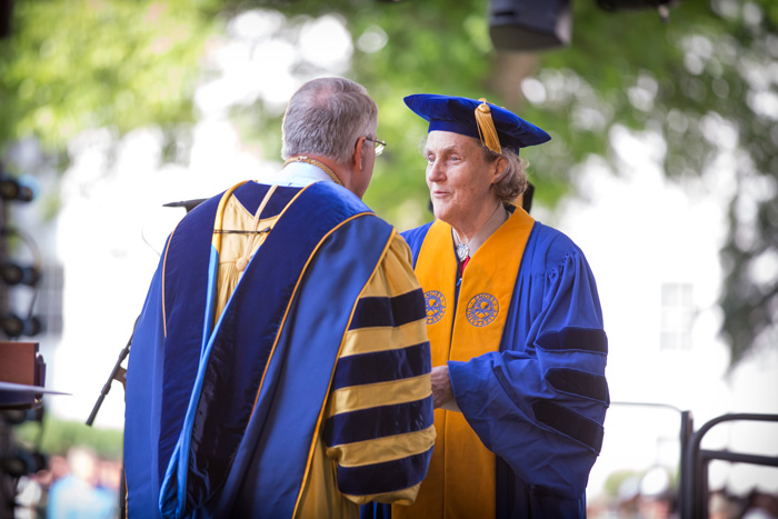 President Wagner congratulates Colorado State University professor Temple Grandin as she receives an honorary degree for her contributions as an autism advocate and expert on animal behavior.