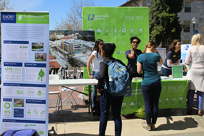 people talking at emory sustainability booth