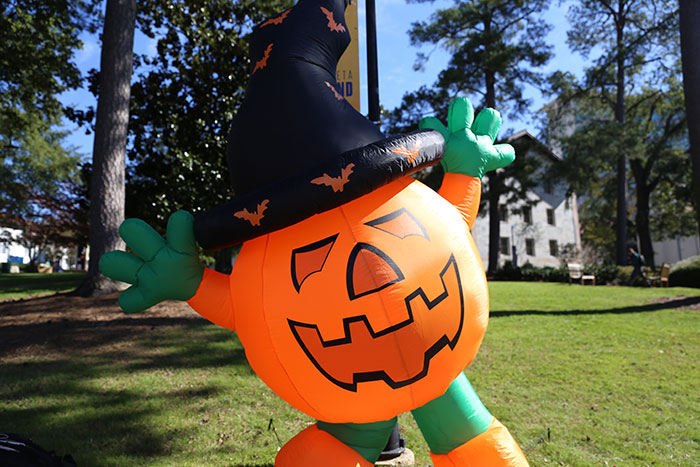 A large, inflatable pumpkin decorates Asbury Circle for Dooleyween.