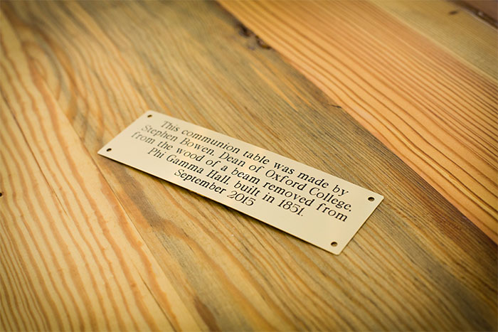 A brass plaque will be affixed to the table, commemorating the table's dedication and origin. 