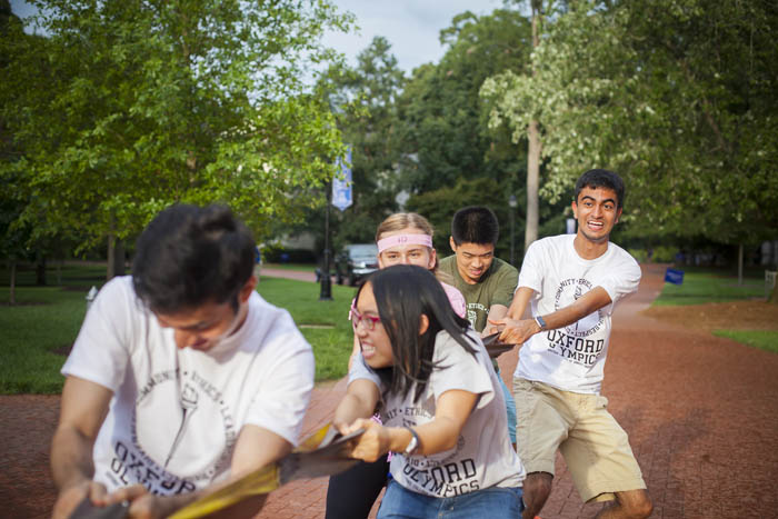 Five Oxford students strain hard in a bout of tug-o-war.