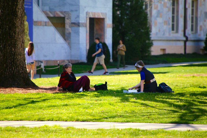 Students, faculty and staff enjoy the warm weather on the Quad.