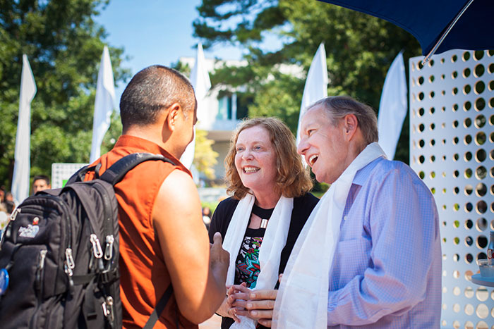 President Sterk and Professor Elifson talk with attendees.