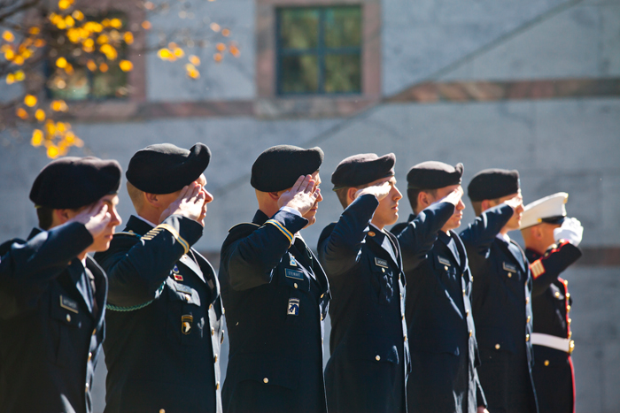 The Emory color guard salutes during the Veterans Day Ceremony. 