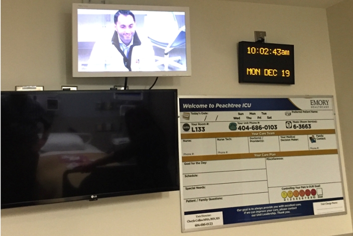 Critical care experts, such as Ramzy Rimawi, MD, connect to the patient room for remote caretaking and consulting.