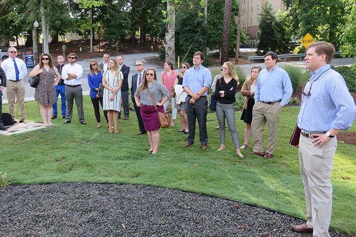 Staffers gather at the wetland. 