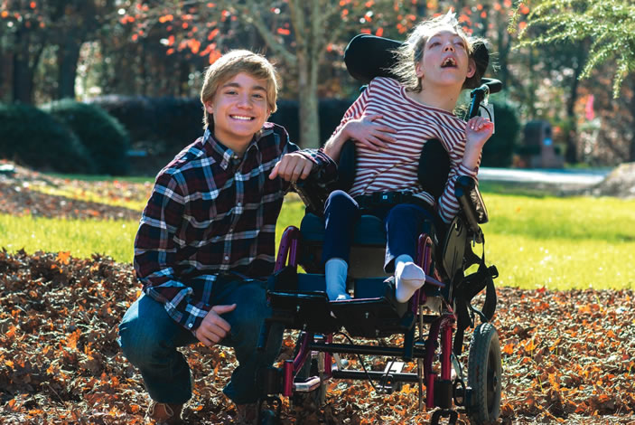 Jake Stinchcomb with his sister Jordan outside on a fall day
