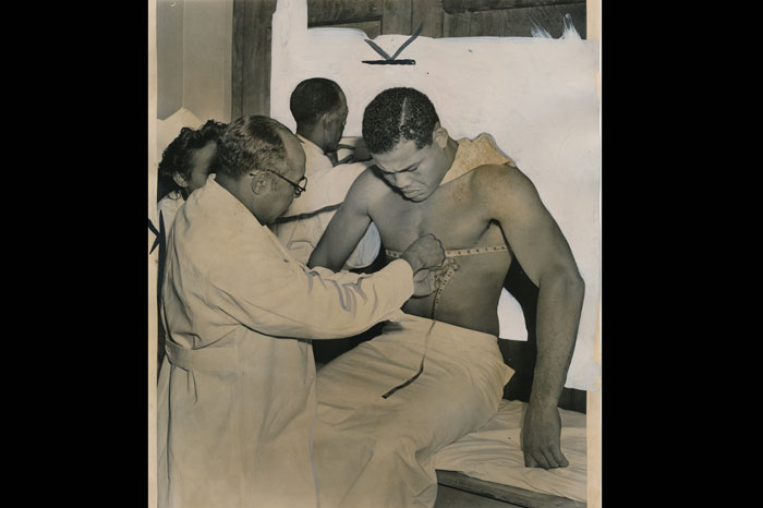 Joe Louis Barrow getting a physical examination when he enlisted in the US Army in January 1942. Photo credit: Pellom McDaniels III collection.