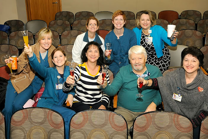 Emory Healthcare staff share a non-alcoholic toast in celebration.