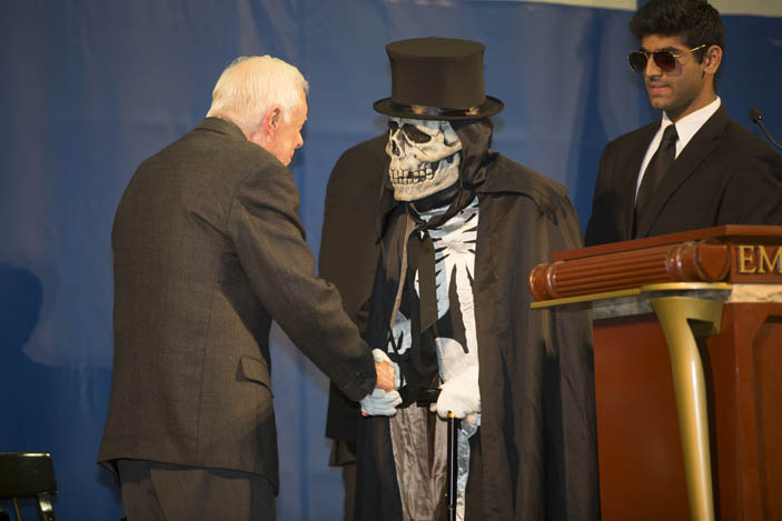 President Jimmy Carter greets Dooley, the "Spirit of Emory" on stage.