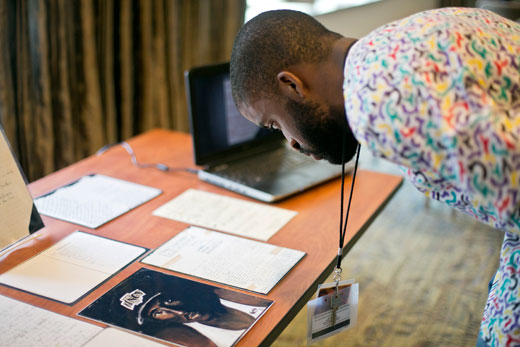 Onyirimba, from Norfolk, Virginia, studies archival materials reflecting the life's work of rapper and poet Tupac Amaru Shakur, provided by Atlanta University Center's Robert W. Woodruff Library Archives Research Center.