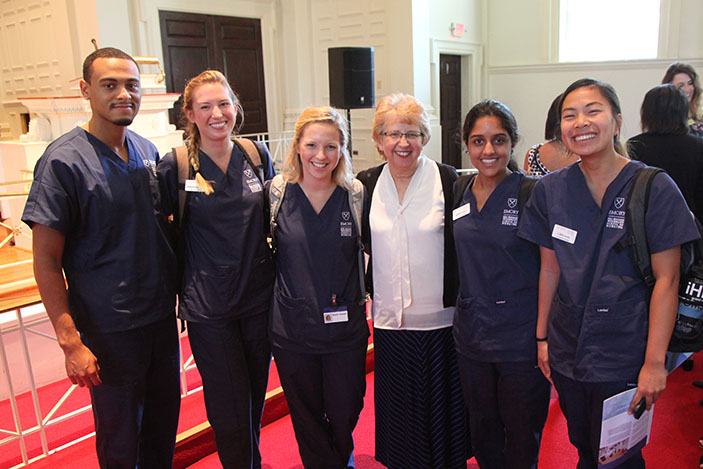 Convocation keynote speaker Nancy Writebol, who was treated for Ebola at Emory two years ago, meets with students after Convocation.