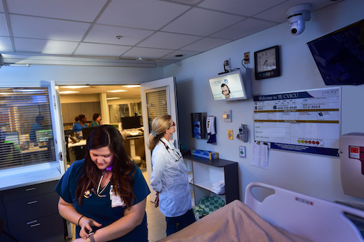 Two nurses work in the eICU