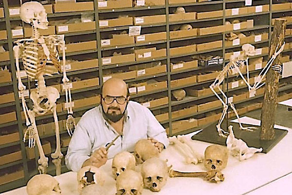 George Armelagos inspects human skulls