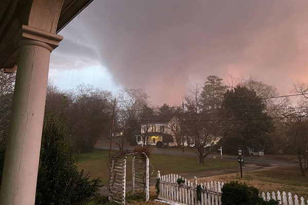 A tornado spins in the distance