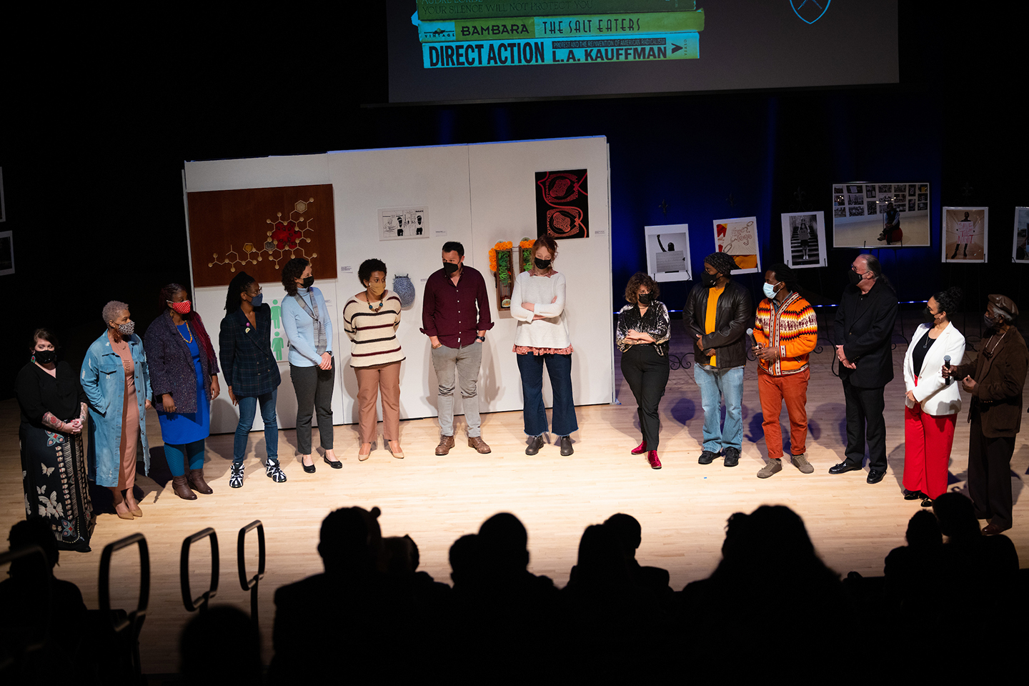Participants gather on stage at the end-of-semester showcase