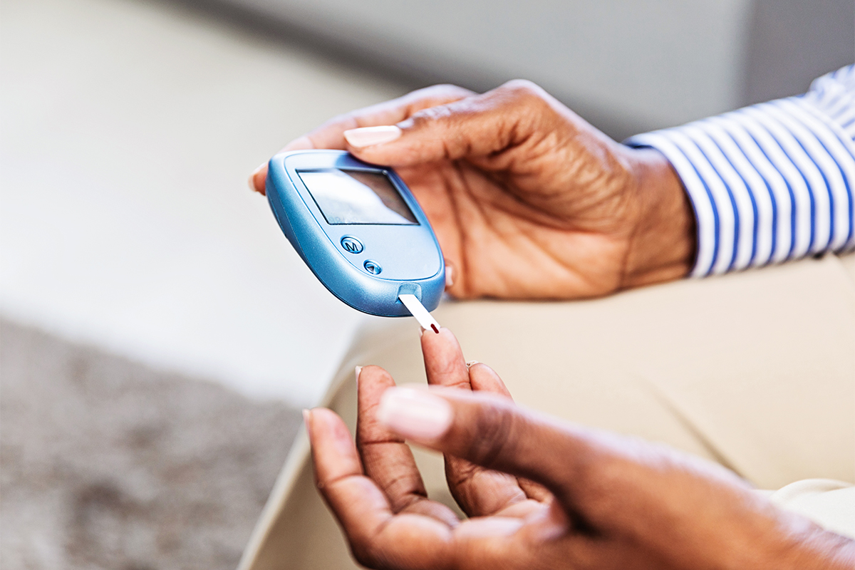 patient testing blood sugar at home